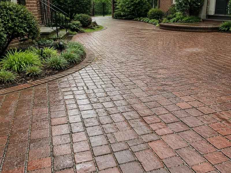 Permeable brick paver entry courtyard with open joints after rainfall in Birmingham, Alabama.
