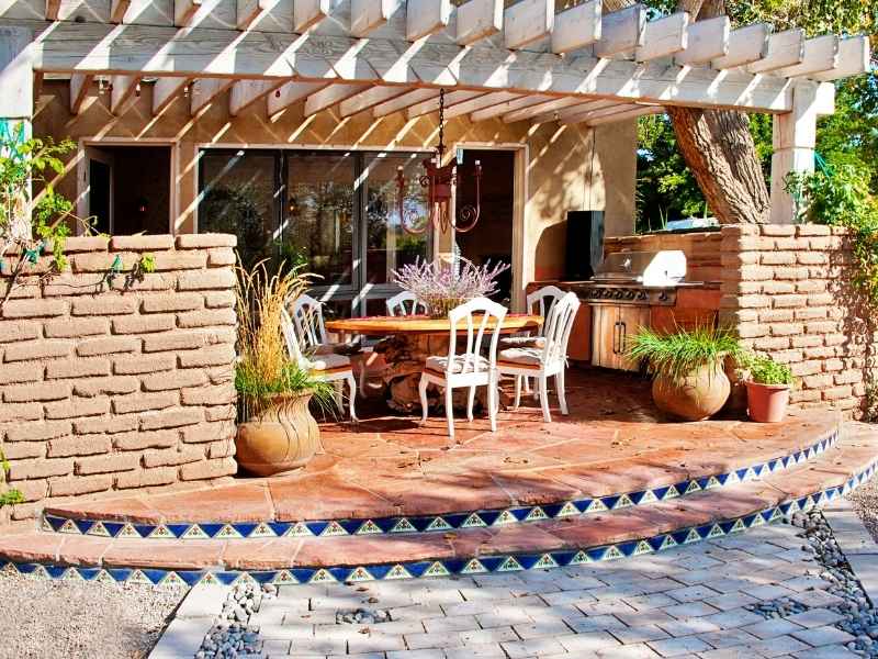 Outdoor kitchen masonry with brick and stone construction under a covered patio in Birmingham Alabama